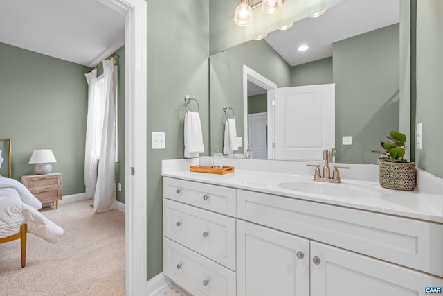 full bathroom with baseboards and vanity