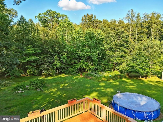 19303 Frazier Rd, Culpeper, VA 22701 - view of green lawn with a deck and a covered pool