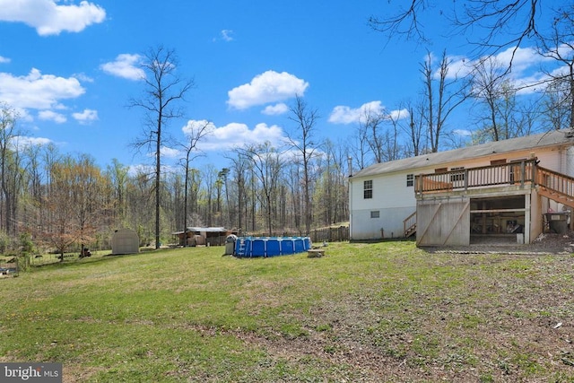 19303 Frazier Rd, Culpeper, VA 22701 - view of grassy yard featuring a deck, an outdoor pool, and stairway