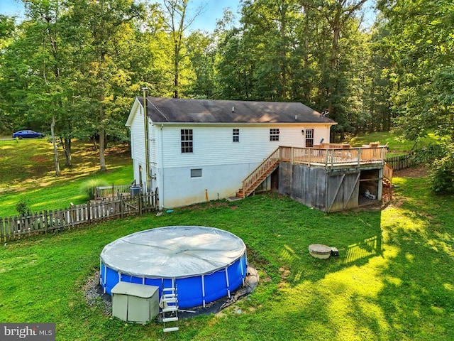 19303 Frazier Rd, Culpeper, VA 22701 - rear view of property with stairway, a wooden deck, a covered pool, roof with shingles, and a wooded view