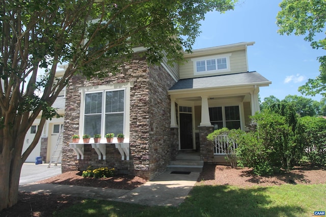 66 Timber Ridge Ln, Zion Crossroads, VA 22942 - view of front of house featuring stone siding, covered porch, and a shingled roof