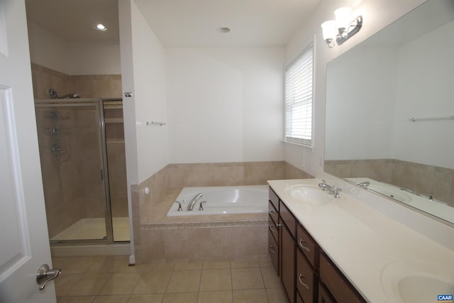 66 Timber Ridge Ln, Zion Crossroads, VA 22942 - full bath featuring a garden tub, double vanity, a stall shower, and tile patterned floors