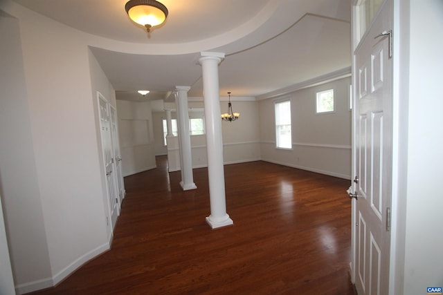 66 Timber Ridge Ln, Zion Crossroads, VA 22942 - entrance foyer featuring decorative columns, dark wood-style floors, and a chandelier
