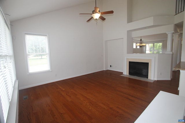 66 Timber Ridge Ln, Zion Crossroads, VA 22942 - unfurnished living room with wood finished floors, a chandelier, a ceiling fan, high vaulted ceiling, and a fireplace with flush hearth