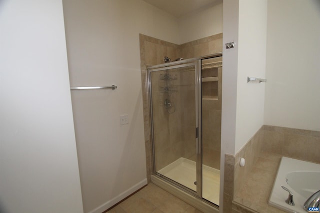 66 Timber Ridge Ln, Zion Crossroads, VA 22942 - bathroom featuring a shower stall, a garden tub, and tile patterned flooring