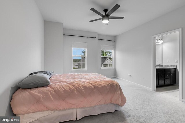 10115 Premier St, Fredericksburg, VA 22408 - bedroom with carpet floors, baseboards, ensuite bathroom, a sink, and ceiling fan