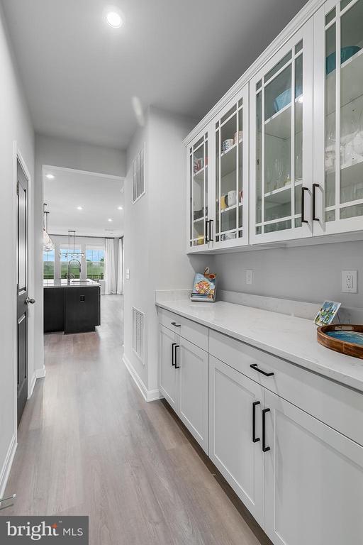 10115 Premier St, Fredericksburg, VA 22408 - bar featuring wood finished floors, recessed lighting, and baseboards