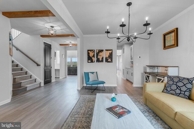 10115 Premier St, Fredericksburg, VA 22408 - living area featuring wood finished floors, stairs, a chandelier, a ceiling fan, and baseboards