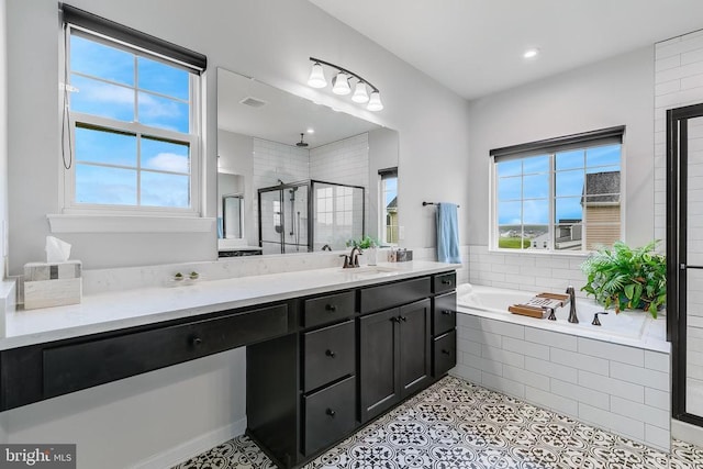 10115 Premier St, Fredericksburg, VA 22408 - bathroom with healthy amount of natural light, a stall shower, a bath, vanity, and recessed lighting