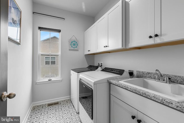 10115 Premier St, Fredericksburg, VA 22408 - clothes washing area with washer and dryer, baseboards, and cabinet space