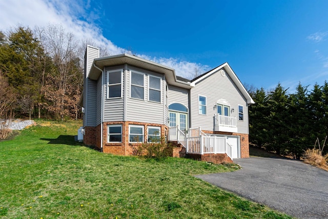 173 Valley View Ave, Mount Sidney, VA 24467 - view of front of property featuring brick siding, a chimney, asphalt driveway, and a front lawn