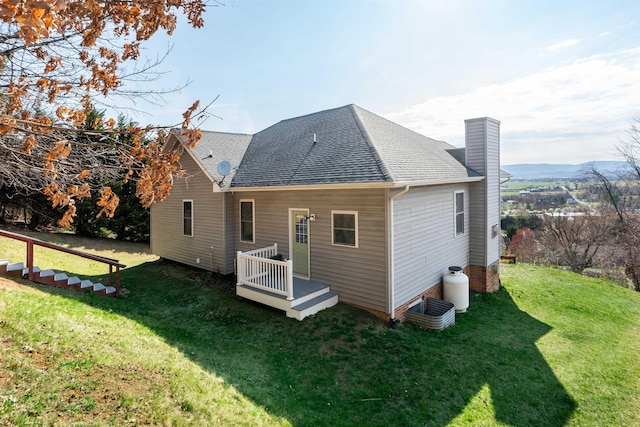 173 Valley View Ave, Mount Sidney, VA 24467 - back of property featuring a yard, a chimney, and a shingled roof