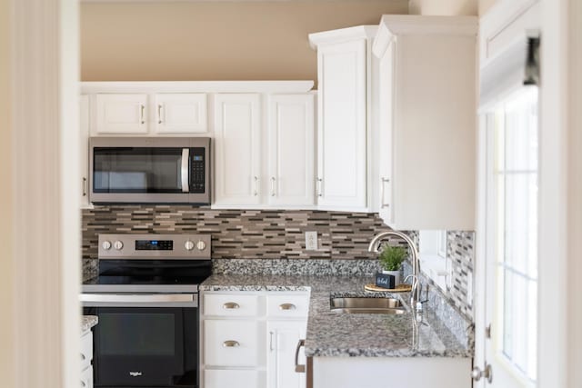 173 Valley View Ave, Mount Sidney, VA 24467 - kitchen with stainless steel appliances, a sink, backsplash, white cabinetry, and light stone countertops
