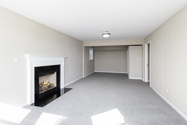 173 Valley View Ave, Mount Sidney, VA 24467 - unfurnished living room featuring carpet flooring, a fireplace with flush hearth, and baseboards