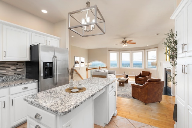 173 Valley View Ave, Mount Sidney, VA 24467 - kitchen with stainless steel fridge, a center island, a ceiling fan, white cabinets, and recessed lighting