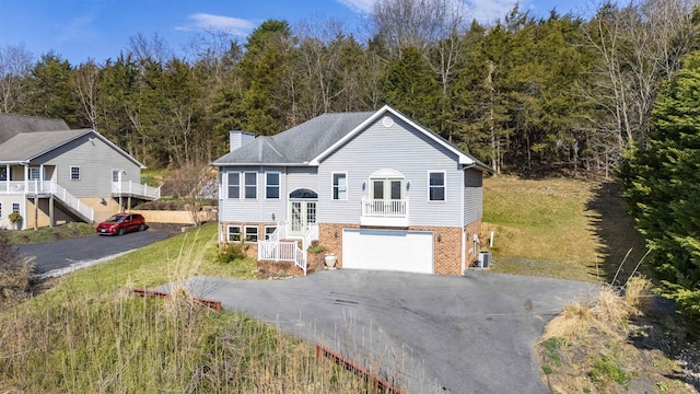173 Valley View Ave, Mount Sidney, VA 24467 - bi-level home featuring french doors, asphalt driveway, stairs, a chimney, and brick siding