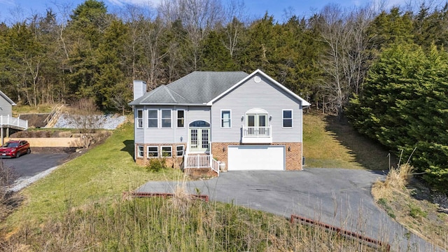 173 Valley View Ave, Mount Sidney, VA 24467 - split foyer home featuring a chimney, french doors, driveway, brick siding, and a garage