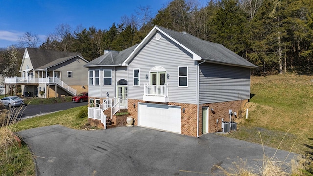 173 Valley View Ave, Mount Sidney, VA 24467 - view of front of property with driveway, brick siding, stairway, an attached garage, and a front yard