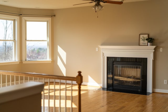 173 Valley View Ave, Mount Sidney, VA 24467 - detailed view of wood finished floors, ceiling fan, baseboards, and a fireplace with flush hearth