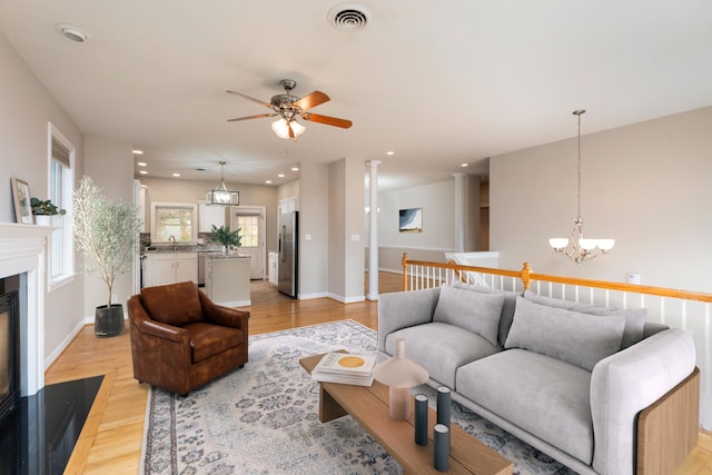 173 Valley View Ave, Mount Sidney, VA 24467 - living area with light wood-style floors, a chandelier, recessed lighting, ceiling fan, and baseboards