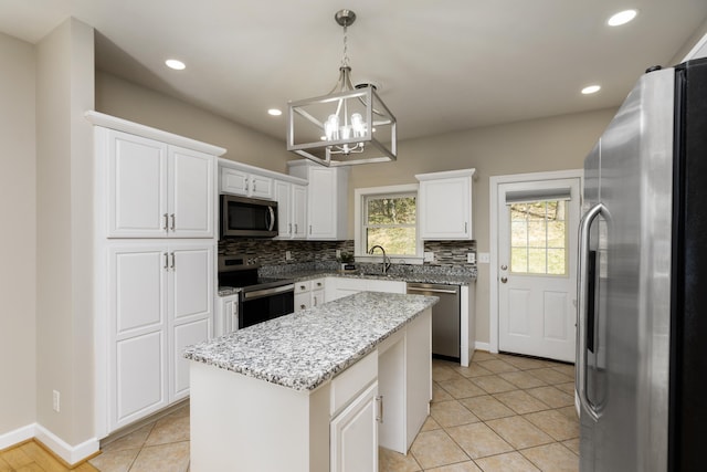 173 Valley View Ave, Mount Sidney, VA 24467 - kitchen with stainless steel appliances, a chandelier, backsplash, a kitchen island, and white cabinetry