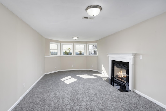 173 Valley View Ave, Mount Sidney, VA 24467 - unfurnished living room featuring carpet flooring, a fireplace with flush hearth, and baseboards