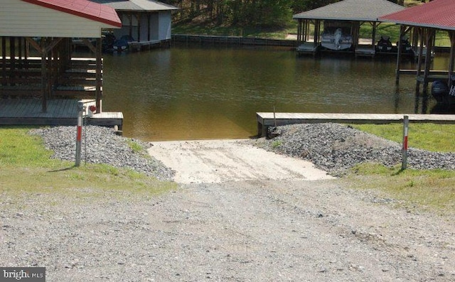 dock area featuring a water view and a boat ramp