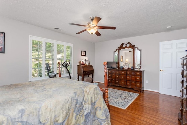 521 Hickory Grove Cir, Harrisonburg, VA 22801 - bedroom with wood finished floors, baseboards, a textured ceiling, and a ceiling fan