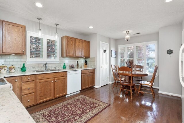 521 Hickory Grove Cir, Harrisonburg, VA 22801 - kitchen with white dishwasher, a sink, baseboards, tasteful backsplash, and dark wood-type flooring