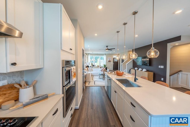 3018 Horizon Rd, Charlottesville, VA 22902 - kitchen featuring a sink, open floor plan, wall chimney exhaust hood, a kitchen island with sink, and stainless steel appliances