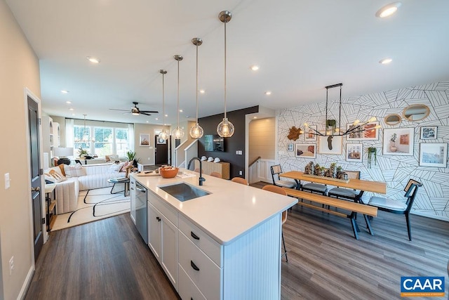 3018 Horizon Rd, Charlottesville, VA 22902 - kitchen with a sink, open floor plan, a chandelier, stainless steel dishwasher, and white cabinets