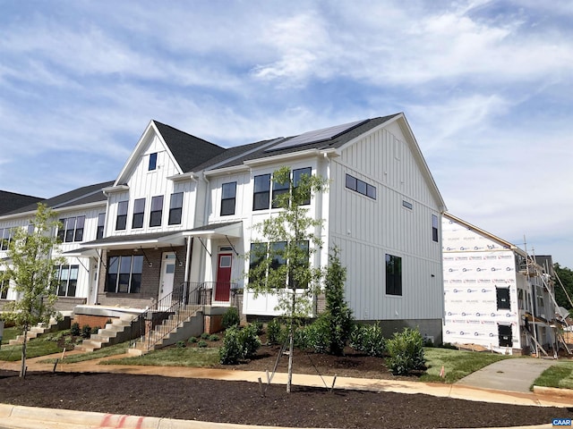 3018 Horizon Rd, Charlottesville, VA 22902 - view of front facade with board and batten siding and roof mounted solar panels