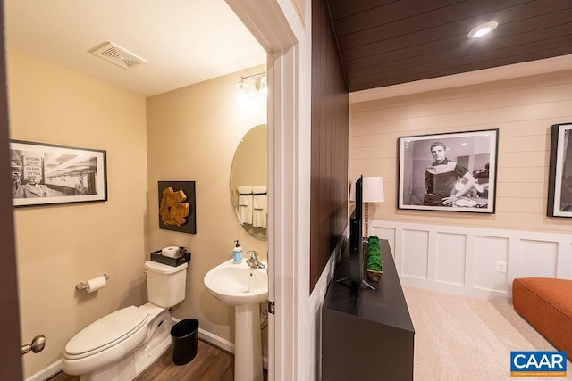 3018 Horizon Rd, Charlottesville, VA 22902 - bathroom featuring toilet, wood finished floors, a sink, and baseboards