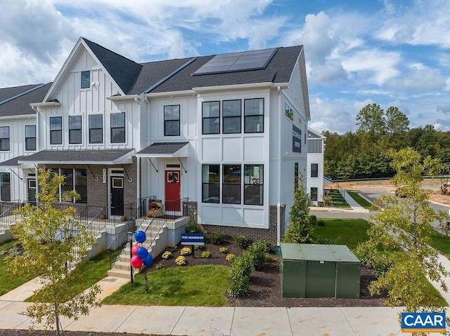 3018 Horizon Rd, Charlottesville, VA 22902 - view of front of property featuring board and batten siding, solar panels, and a shingled roof