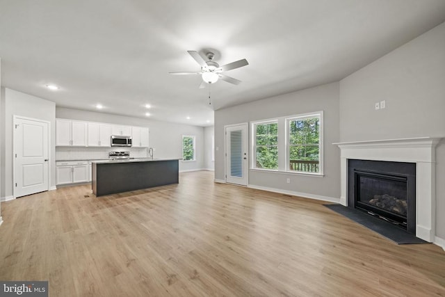 354 Glenmore Ln Lot 35, Keswick, VA 22947 - unfurnished living room featuring ceiling fan, baseboards, light wood-style flooring, and recessed lighting