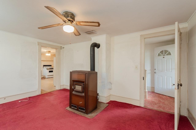 56 Grindstone Rd, Bridgewater, VA 22812 - unfurnished bedroom featuring carpet flooring, a wood stove, ceiling fan, and baseboards