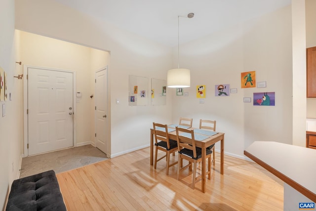 dining area featuring light wood finished floors