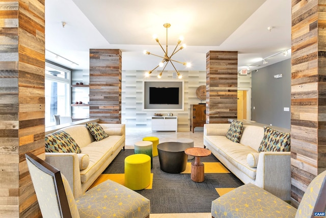 living area featuring an inviting chandelier