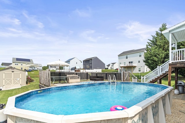 96 Lofty Cir, Stuarts Draft, VA 24477 - view of swimming pool featuring a residential view, a storage unit, stairs, and a wooden deck
