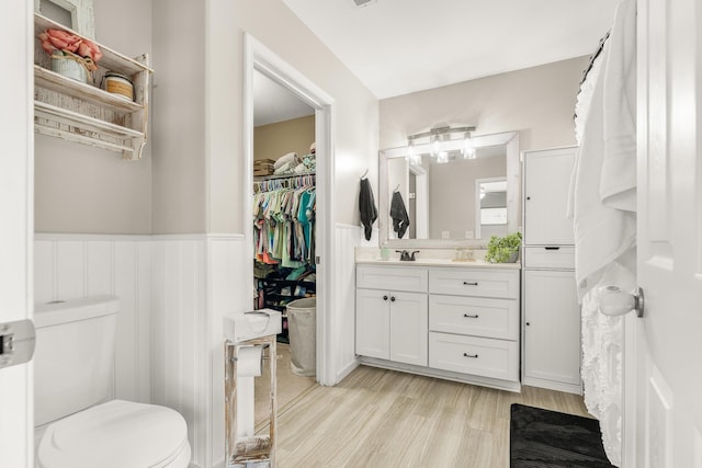 96 Lofty Cir, Stuarts Draft, VA 24477 - full bath featuring wainscoting, vanity, wood finished floors, and a walk in closet