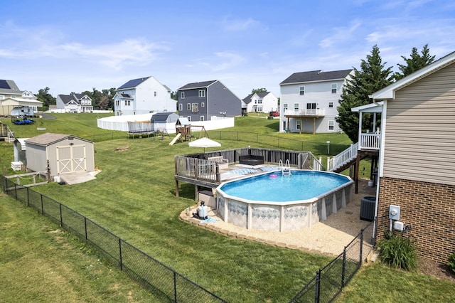 96 Lofty Cir, Stuarts Draft, VA 24477 - view of swimming pool featuring a storage shed, a residential view, and a fenced backyard