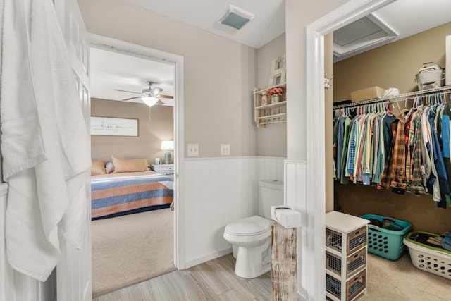 96 Lofty Cir, Stuarts Draft, VA 24477 - bathroom featuring wainscoting, wood finished floors, a ceiling fan, and connected bathroom