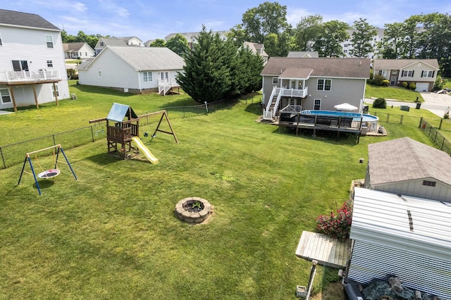 96 Lofty Cir, Stuarts Draft, VA 24477 - fenced backyard featuring a residential view, stairs, a fire pit, a deck, and a playground