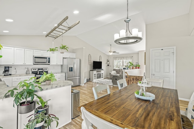 96 Lofty Cir, Stuarts Draft, VA 24477 - dining space with light wood-style floors, a ceiling fan, a chandelier, high vaulted ceiling, and recessed lighting