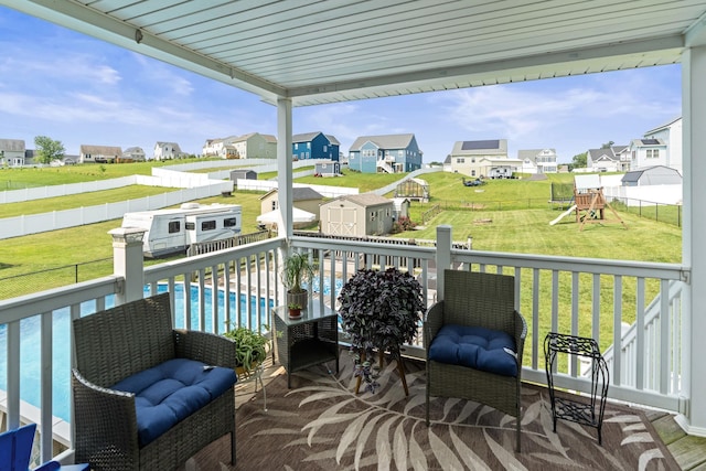 96 Lofty Cir, Stuarts Draft, VA 24477 - deck featuring a storage unit, a residential view, a fenced backyard, and a playground