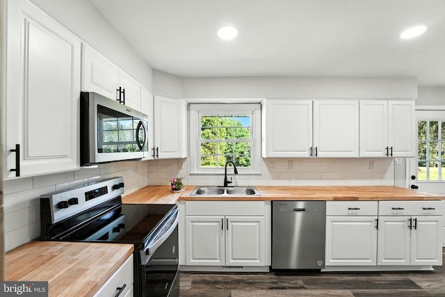 9377 General Winder Rd, Rapidan, VA 22733 - kitchen with stainless steel appliances, butcher block countertops, plenty of natural light, dark wood-style floors, and recessed lighting