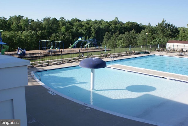9528 Fall Haven Rd, Fredericksburg, VA 22407 - community pool with fence, a patio, and a forest view