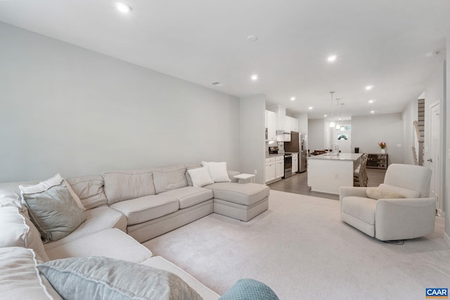 712 Empire St, Charlottesville, VA 22901 - living room with recessed lighting and light wood-style flooring