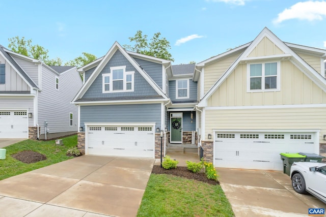 712 Empire St, Charlottesville, VA 22901 - craftsman house featuring concrete driveway, board and batten siding, stone siding, and an attached garage