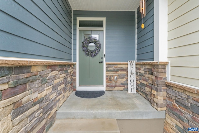 712 Empire St, Charlottesville, VA 22901 - doorway to property featuring stone siding and covered porch